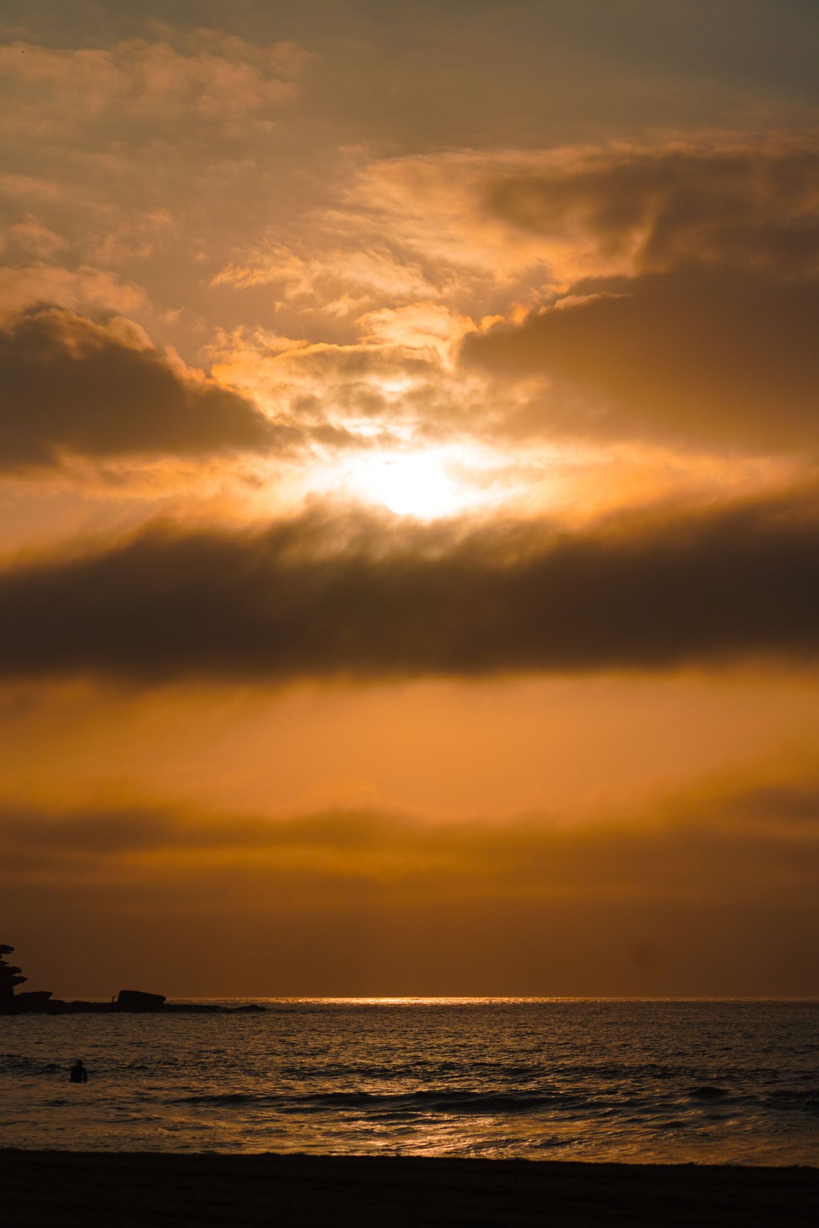 Cruise ship at sunset on the open ocean